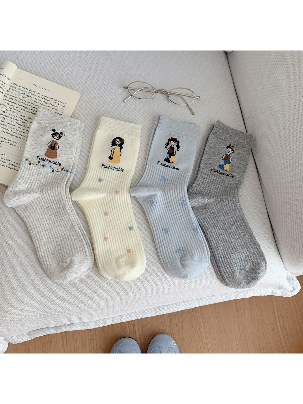 Four cartoon girl crew sock styles displayed together