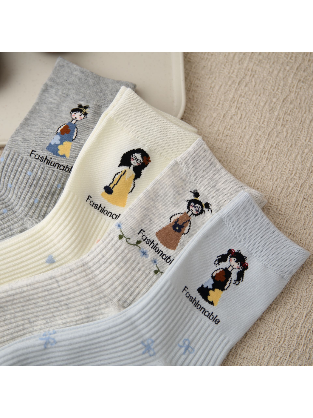 Close-up of four cartoon motifs and ribbed accent patterns