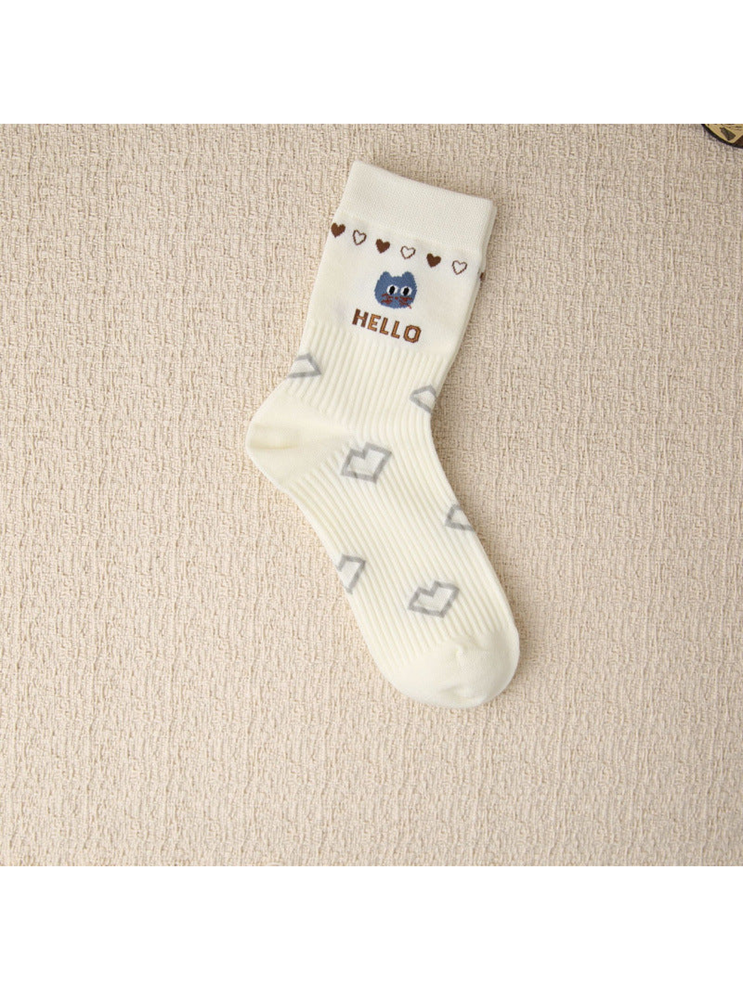 Ivory ribbed crew sock with blue cat face, hearts and Hello lettering