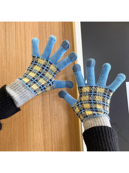 Blue and gray checked gloves worn with palms facing forward