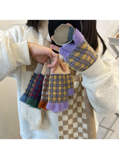 Plaid fingerless gloves worn while several color options are held together