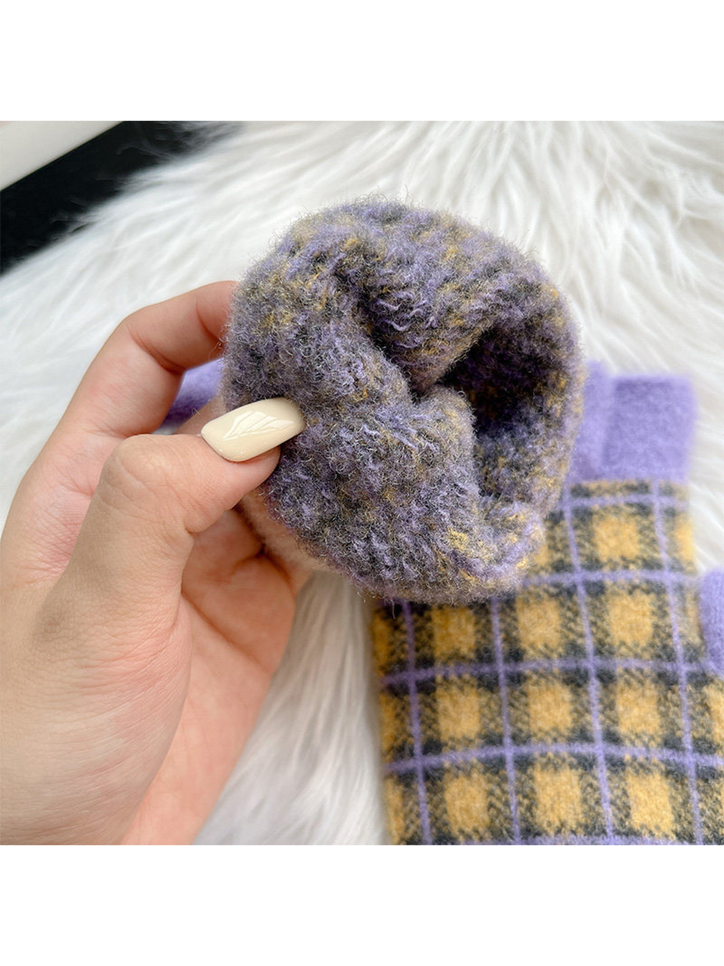 Close-up of the fuzzy texture inside a fingerless glove wrist opening