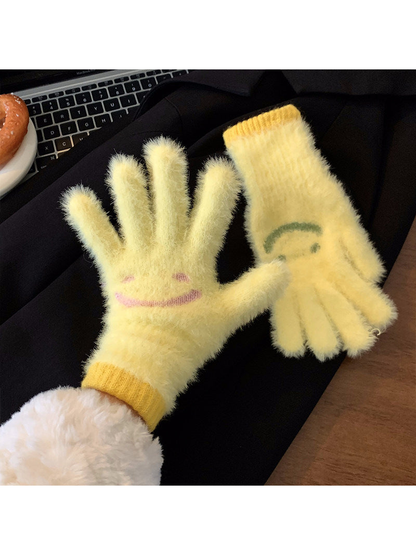 Yellow fuzzy smiley-face gloves showing palm and back views