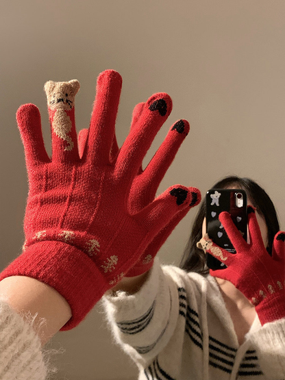 Red cat motif gloves worn in a low-angle mirror scene