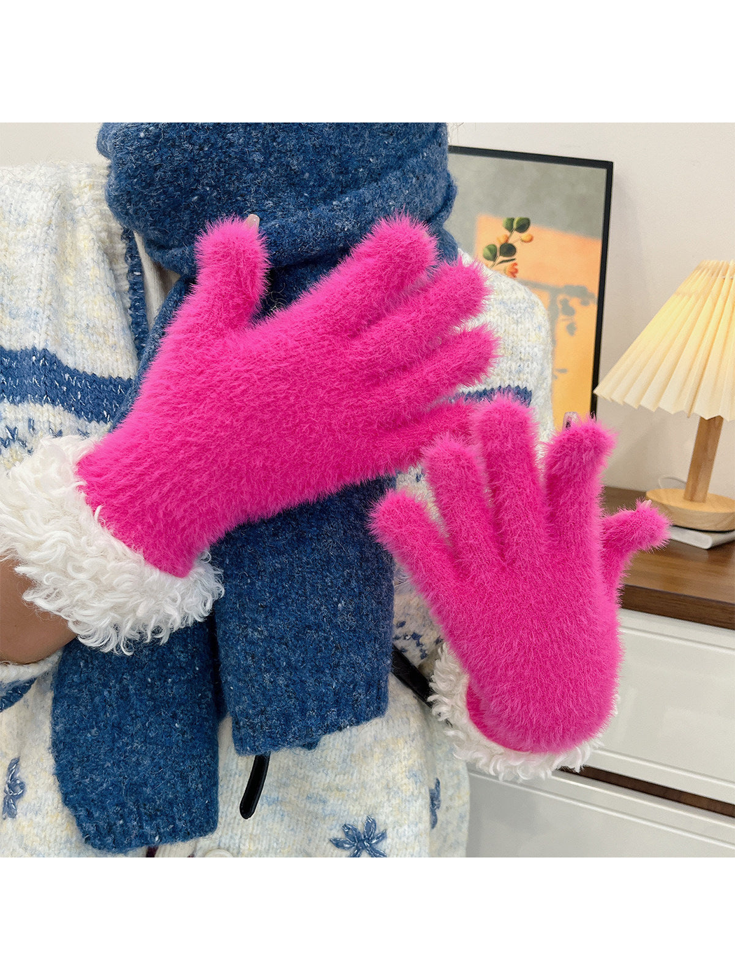 Fuchsia fuzzy gloves with curly white cuffs worn with a blue scarf