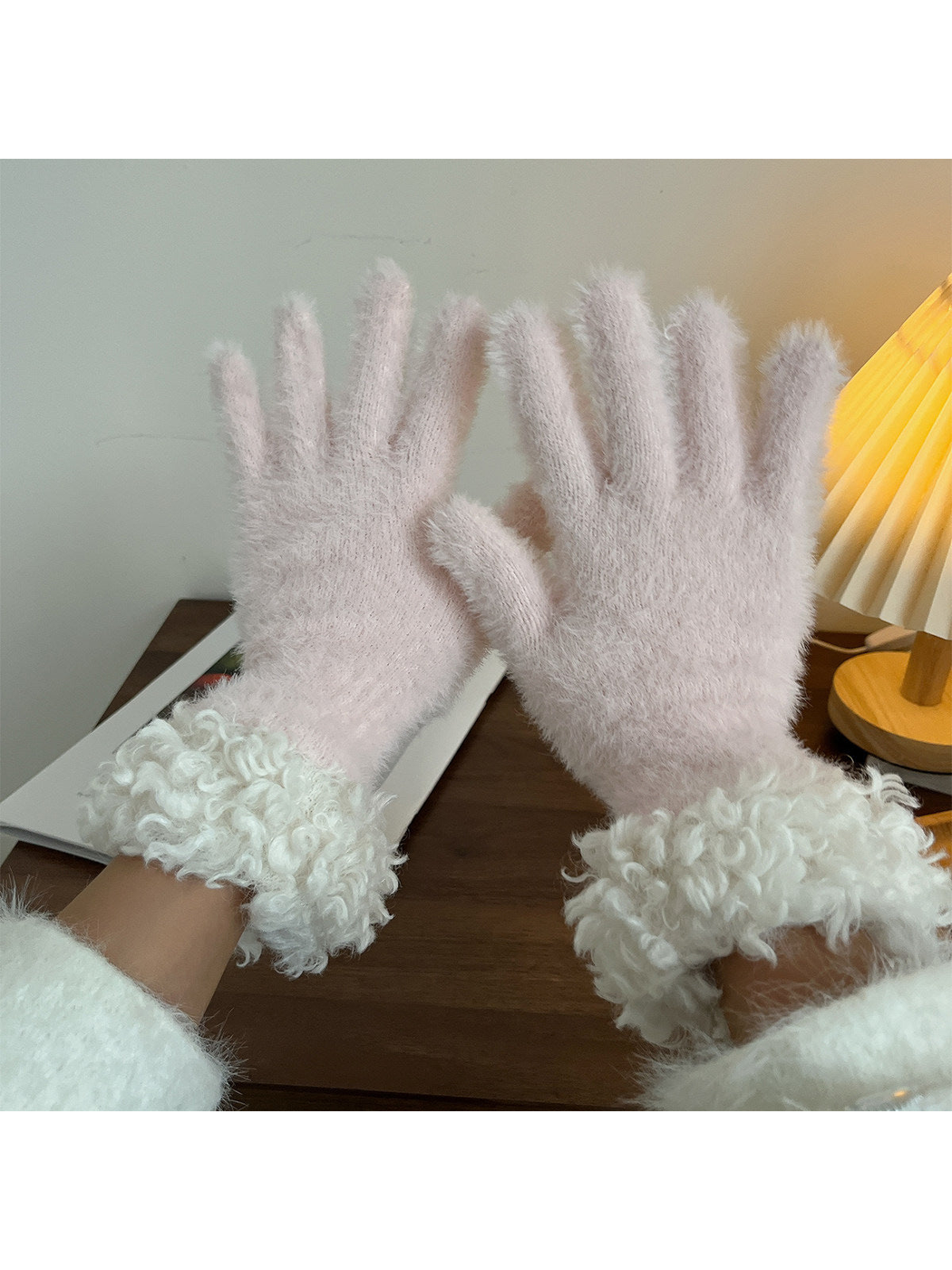 Light pink fuzzy gloves with curly white cuffs, pair view
