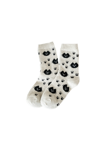 Beige crew socks with black cat faces and paw prints