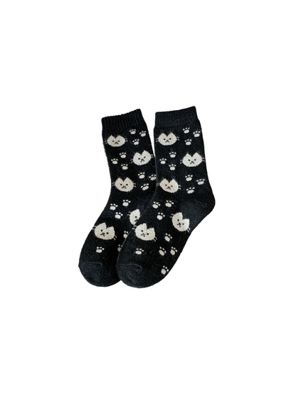 Black crew socks with cream cat faces and paw prints