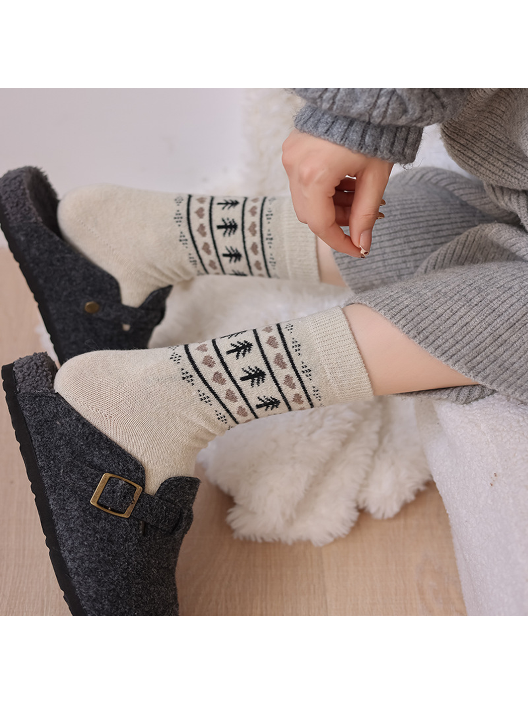 Cream patterned crew socks styled with charcoal clogs