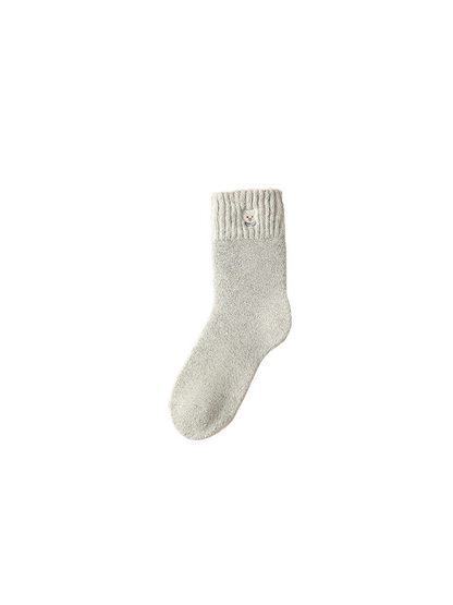Light gray crew sock with ribbed cuff and small bear-face patch, isolated view