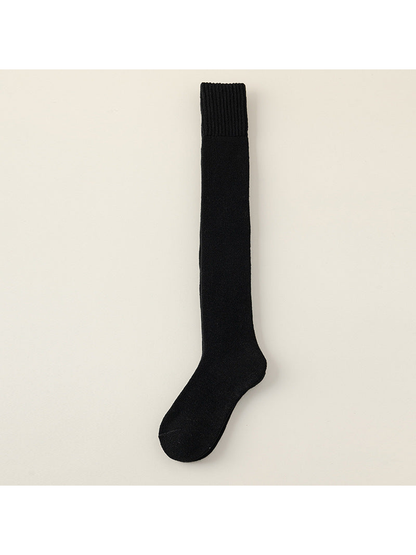 Black over-the-knee sock with a wide ribbed cuff