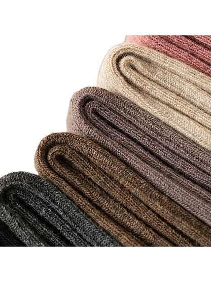 Close-up of folded ribbed socks in assorted colors