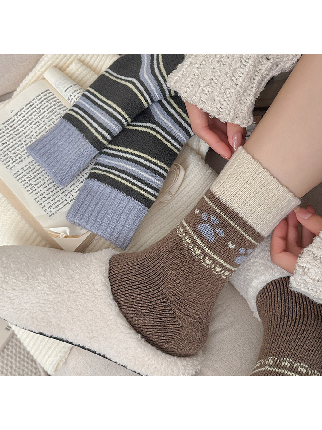 Close side view of a brown motif sock worn with an ivory cuff and cream slipper