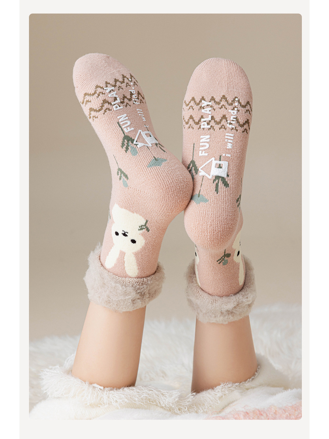 Dusty pink rabbit crew socks worn with the soles facing forward