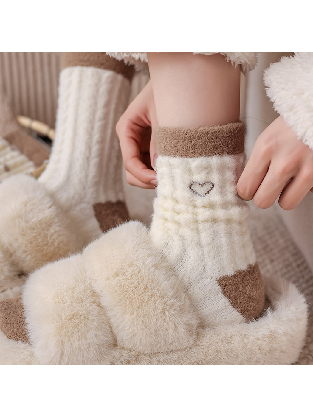 Outlined-heart fuzzy crew sock shown with a plush cream slipper