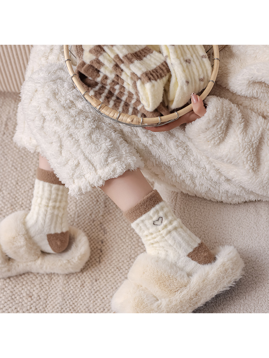 Outlined-heart fuzzy crew socks styled with plush cream slippers