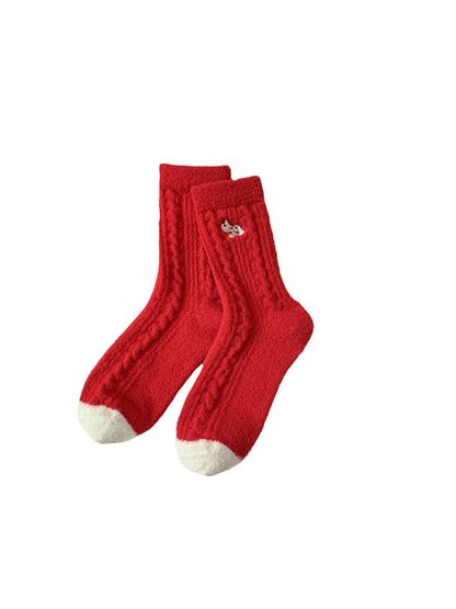 Red fuzzy crew socks with ivory toes and animal embroidery
