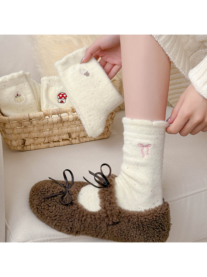 Ivory fuzzy bow-embroidered crew socks styled with brown fuzzy slippers