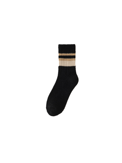 Black fuzzy crew sock with a striped ribbed cuff on a white background