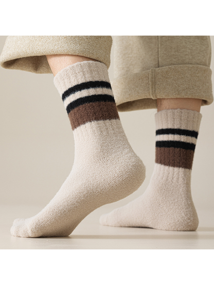 Light beige striped crew socks worn with cuffed trousers