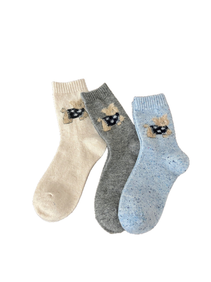 Ivory, light gray and light blue crew socks with fuzzy cat motifs