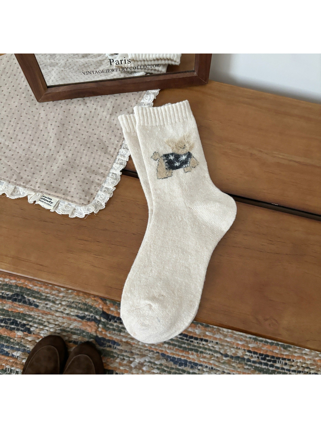 Ivory crew socks with a fuzzy cat motif and ribbed cuffs