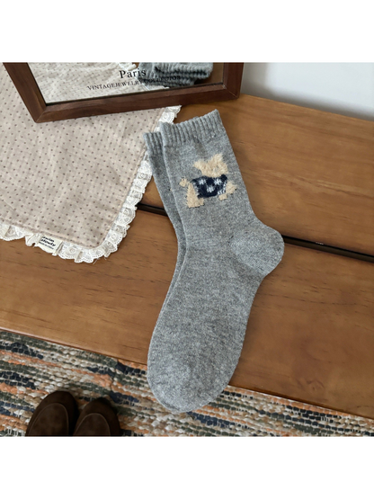 Light gray crew socks with a fuzzy cat motif and ribbed cuffs