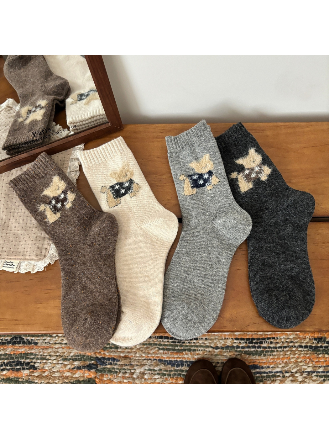 Brown, ivory, light gray and dark gray cat motif crew socks laid flat
