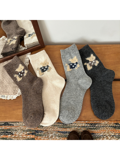 Brown, ivory, light gray and dark gray cat motif crew socks laid flat