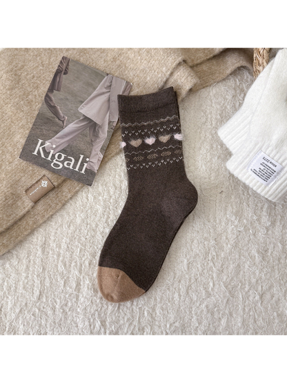 Dark brown crew sock with fuzzy heart and geometric motif