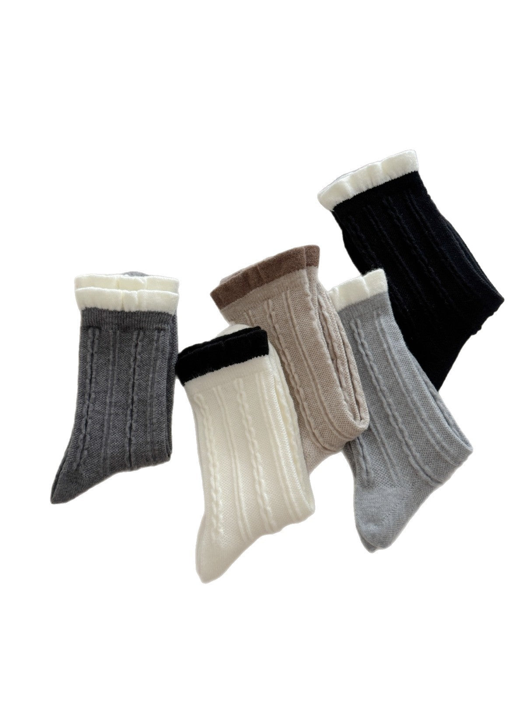 Five cable-knit crew sock colors with contrasting ruffled cuffs displayed together