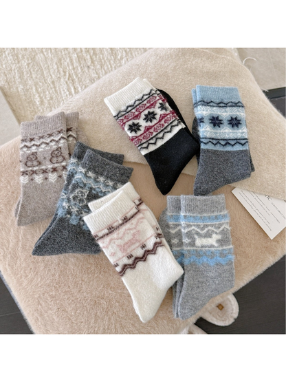 Six fuzzy patterned crew sock styles displayed together