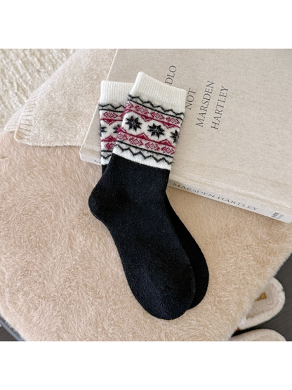 Black crew socks with burgundy snowflake and geometric bands