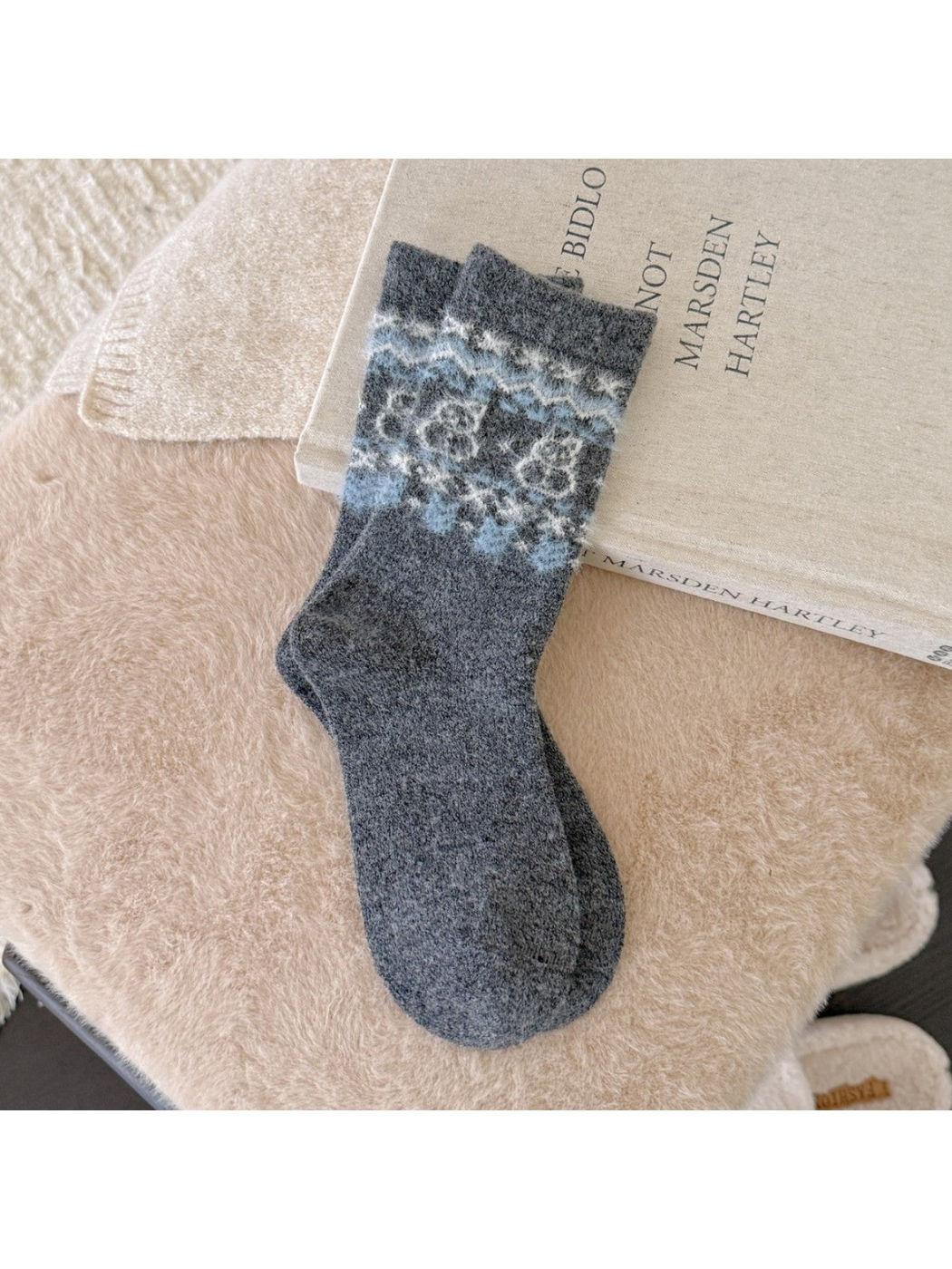 Dark gray crew socks with a fuzzy blue snowman pattern