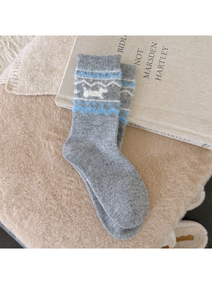 Light gray crew socks with a fuzzy blue dog pattern