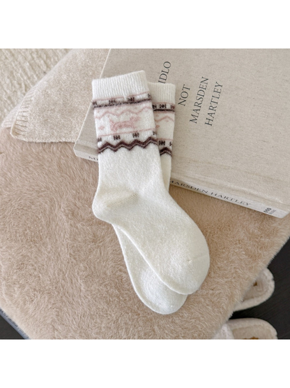 White crew socks with a fuzzy pink dog and brown geometric bands