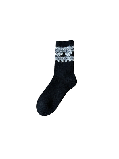 Black crew sock with a contrasting fuzzy bow and geometric cuff motif