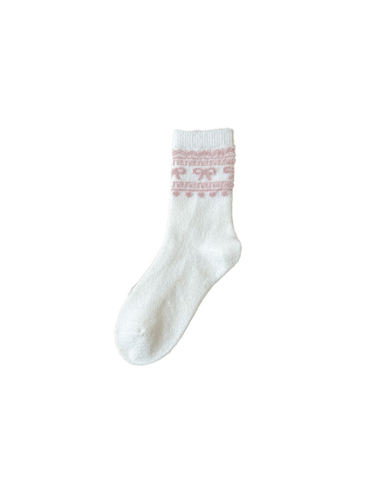 White crew sock with a pink bow and geometric cuff motif