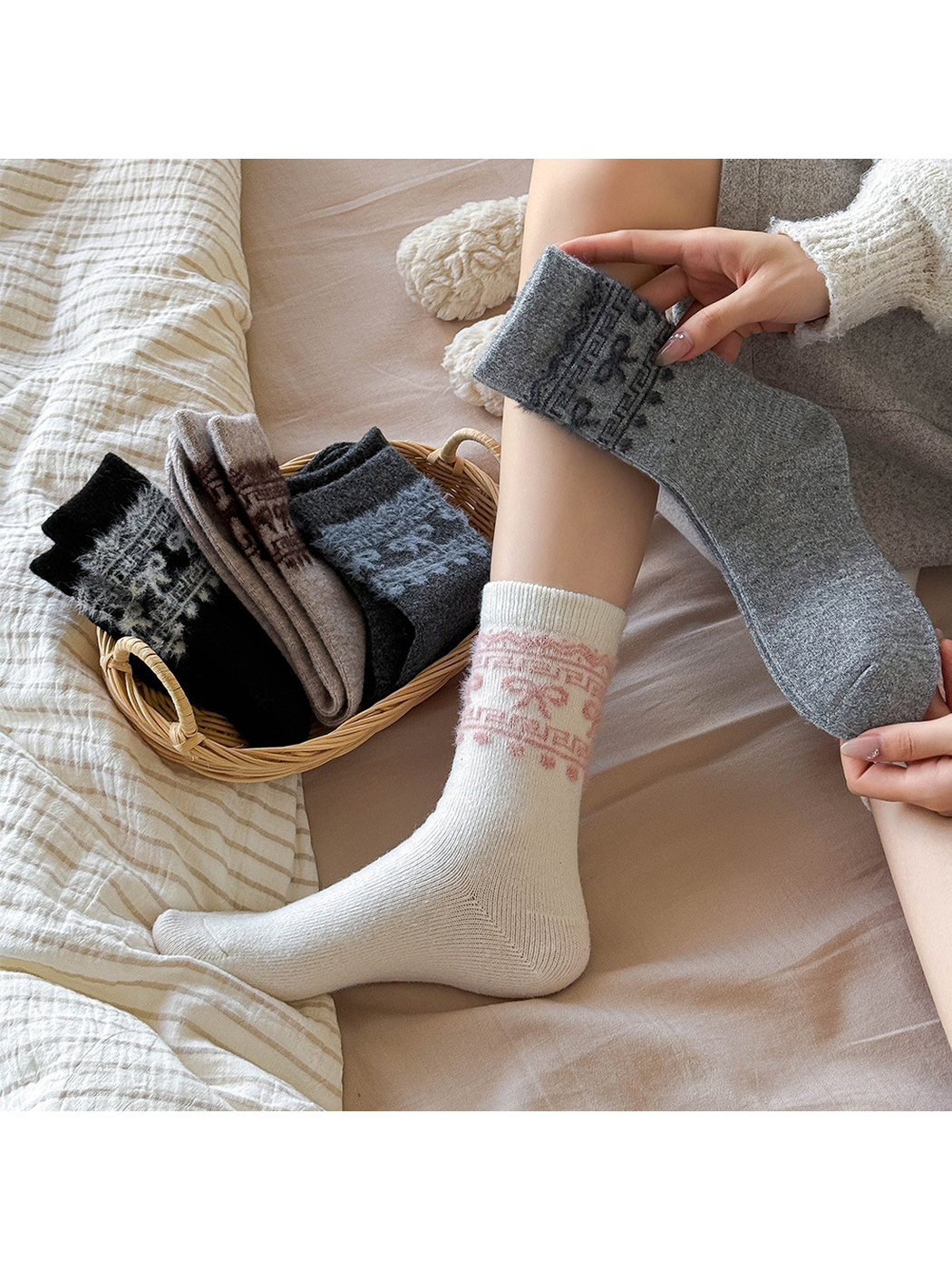 White bow-pattern crew sock worn while a gray variant is held beside folded color options