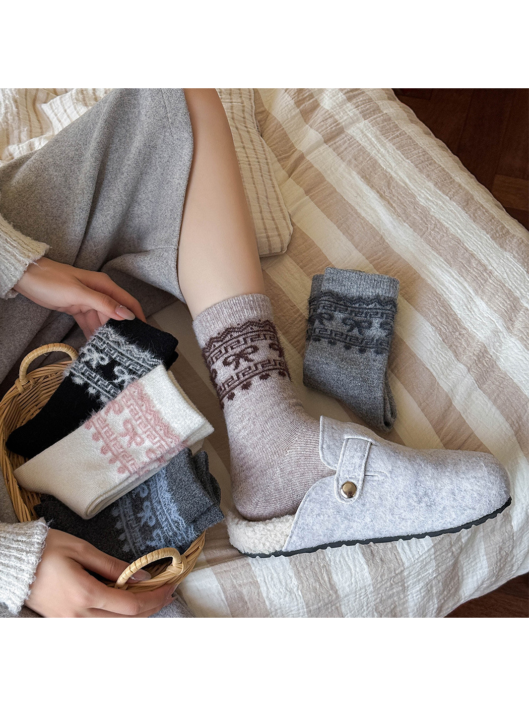 Light taupe bow-pattern crew sock styled with a gray slipper and folded color variants
