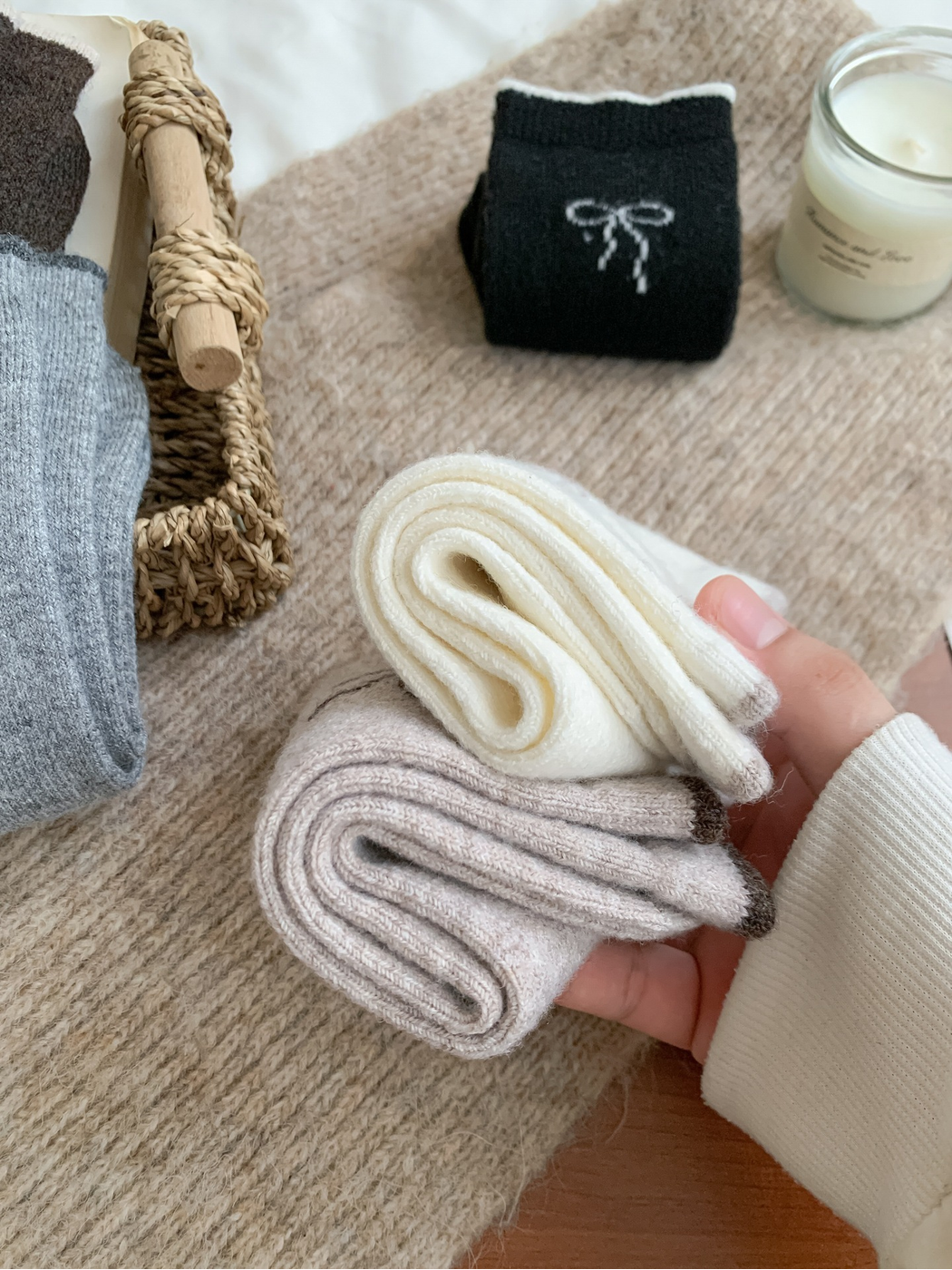 Folded socks showing the knit thickness and contrasting cuff edges