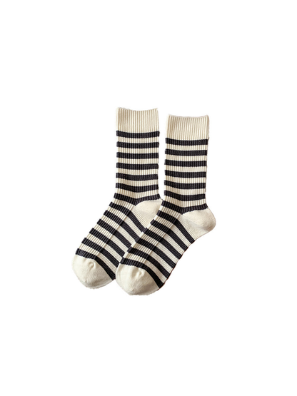 Ivory crew socks with narrow dark stripes on a white background