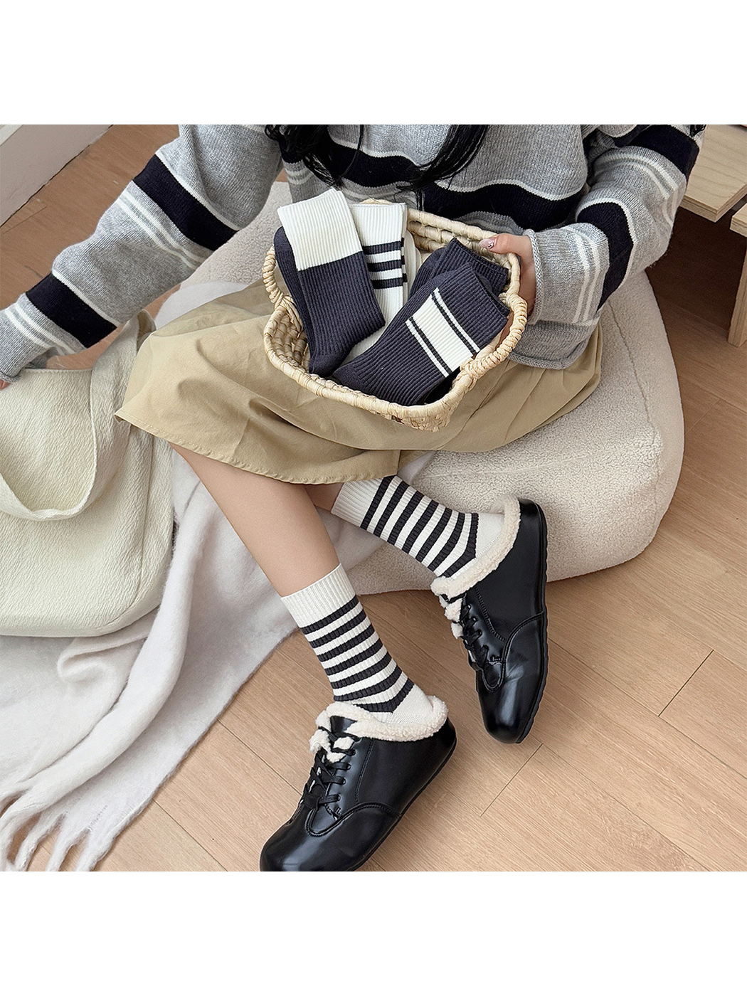 Narrow-striped crew socks styled with black shearling-trim shoes
