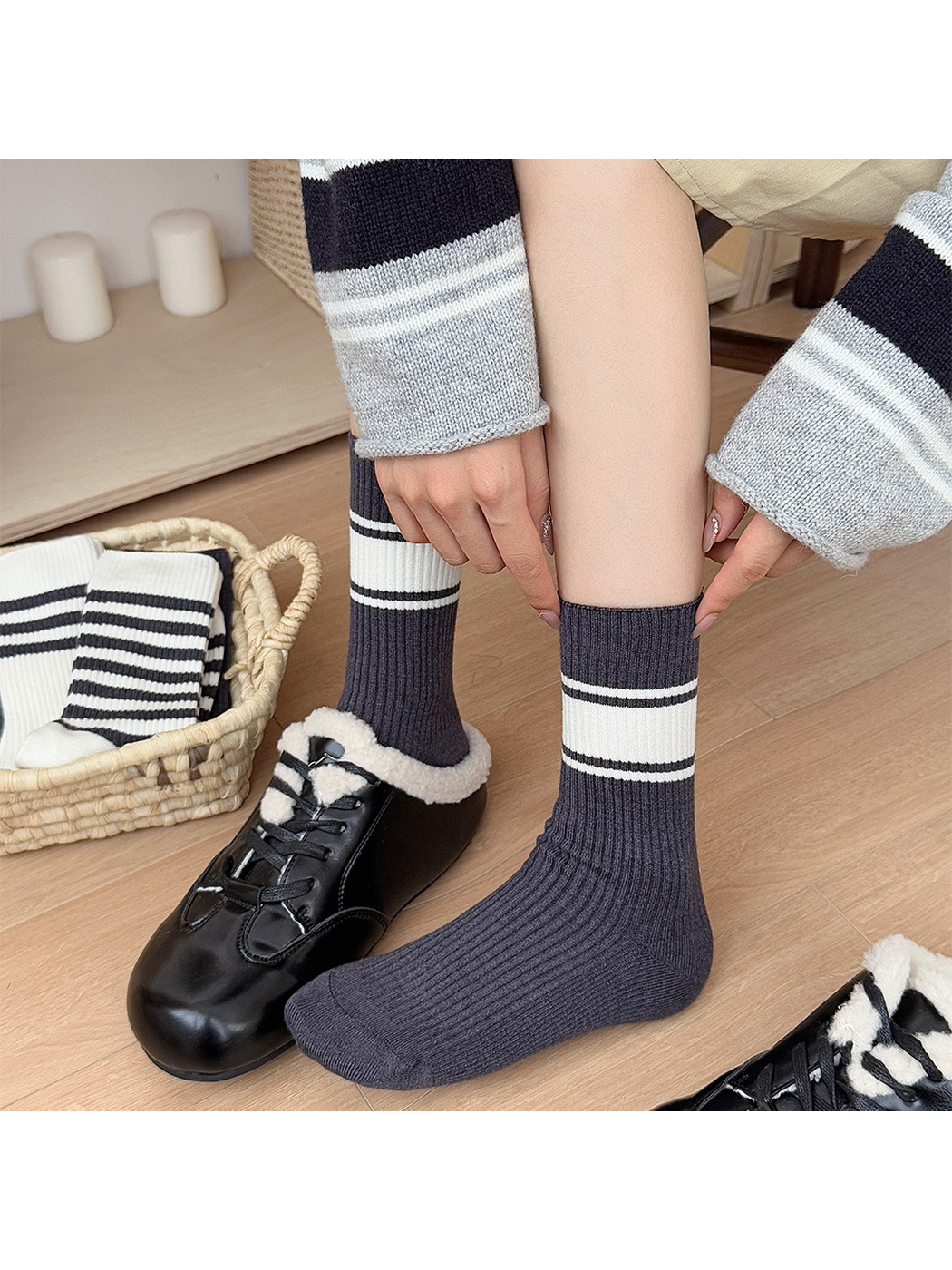 Dark gray ribbed crew socks with a wide ivory cuff band worn with black shoes