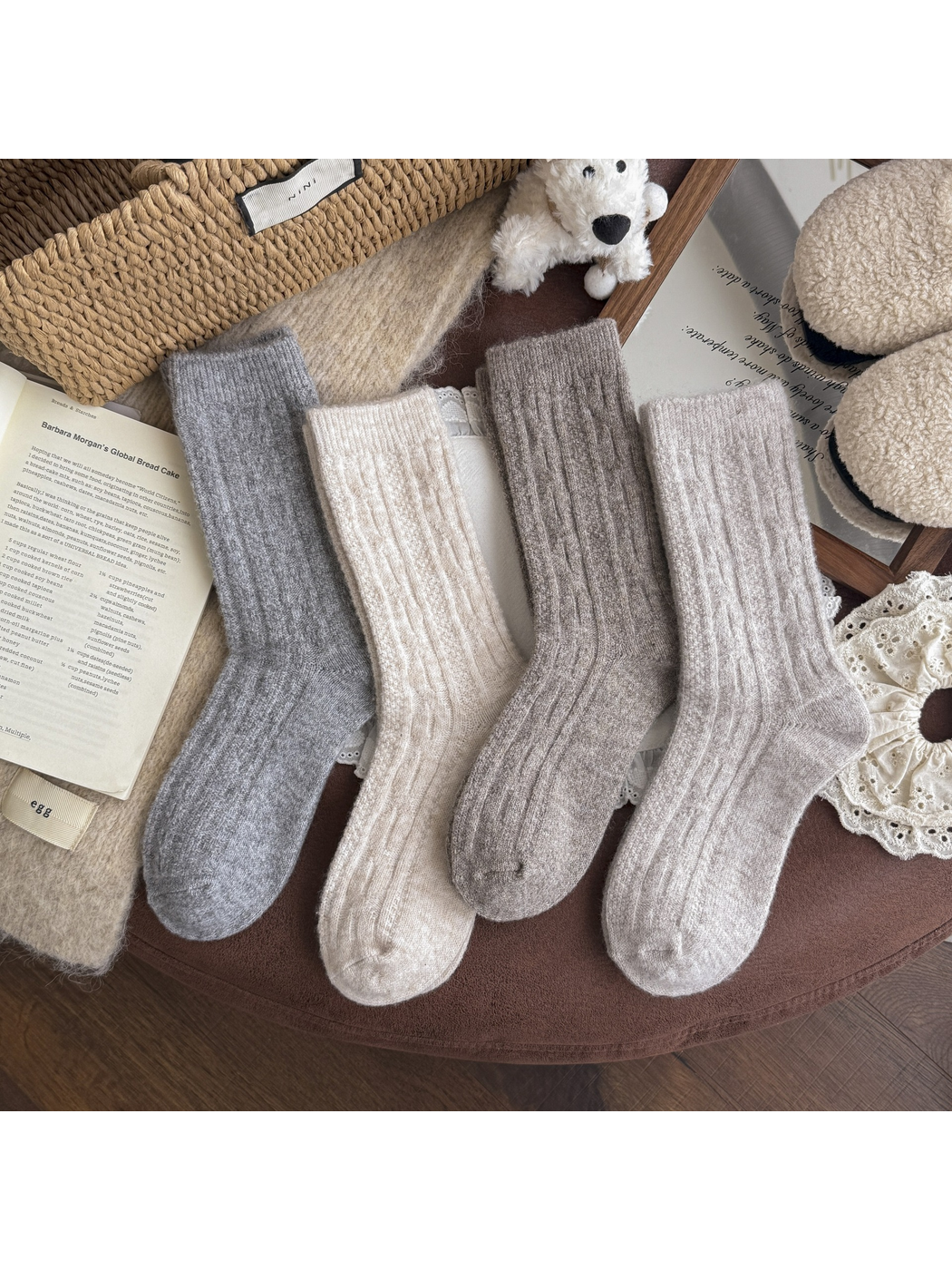 Four neutral-color patterned crew socks arranged together