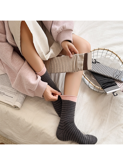 Dark gray striped crew socks worn beside khaki, light gray, black and white options