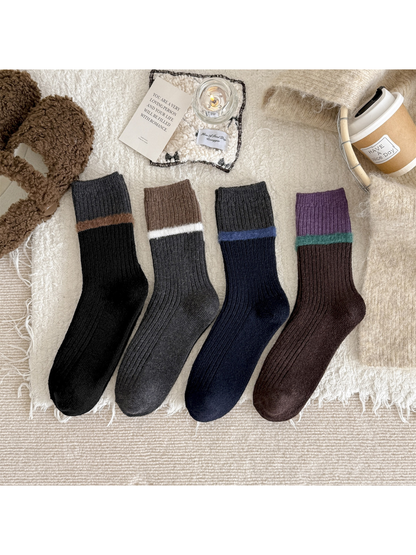 Four color-blocked ribbed crew sock styles arranged together
