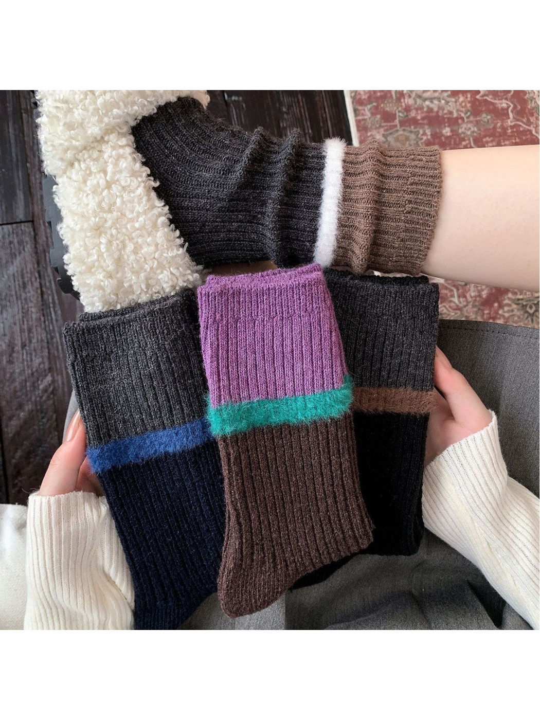 Four color-blocked ribbed sock styles held together