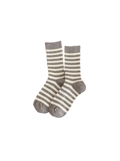 Light gray and ivory striped crew socks on a white background