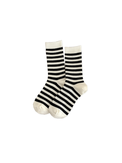 Ivory crew socks with black horizontal stripes on a white background